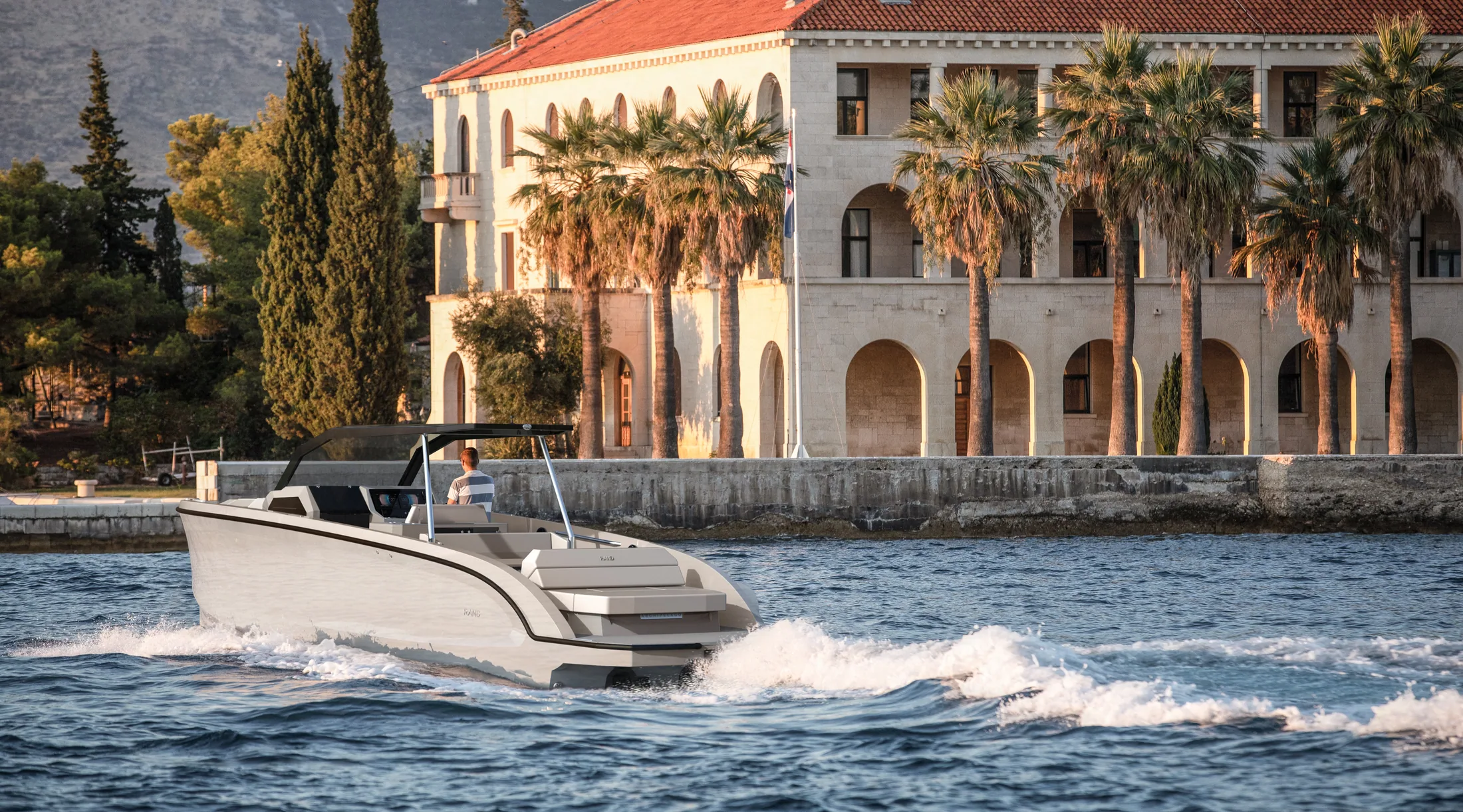 Escape 32 passing a waterfront villa